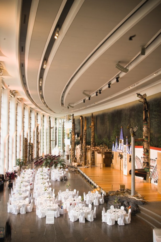 A large room with tables and chairs in it.