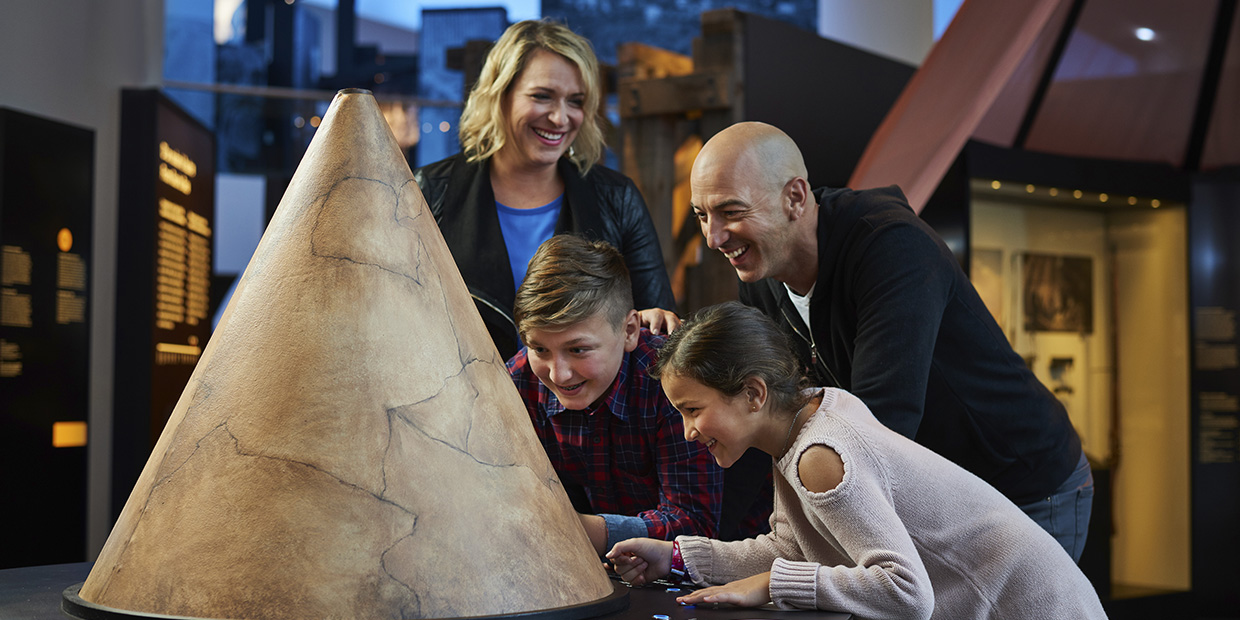 A group of people looking at an artifact in the Canadian Museum of History, in Ottawa.