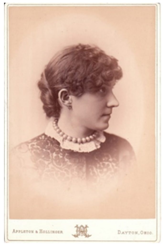 An old photograph showing a women's hairstyle of the era.