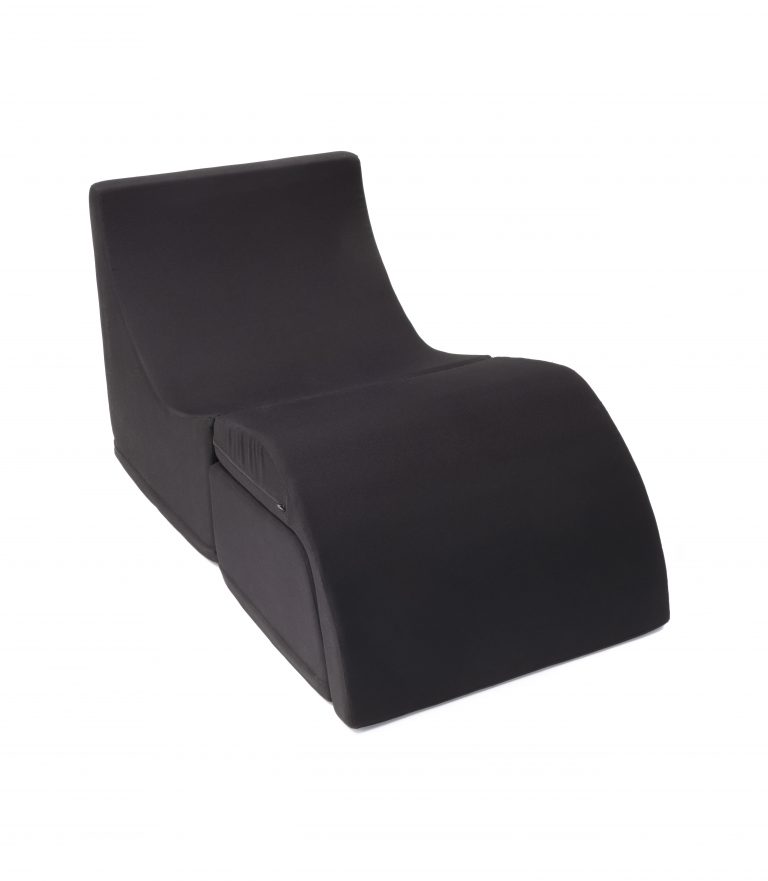 A modern black chaise lounge, designed by Karim Rashid.